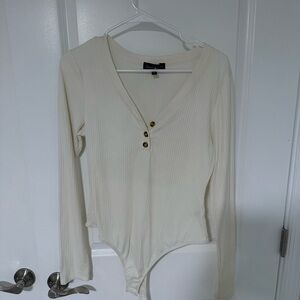 Cream white body suit with brown buttons